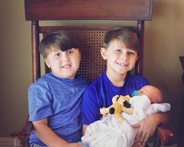 Baby Reid and proud big brothers, Sawyer & Shepherd